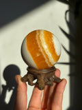 55mm Yellow Banded Calcite Sphere with stand