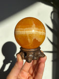 60mm Yellow Banded Calcite Sphere with stand
